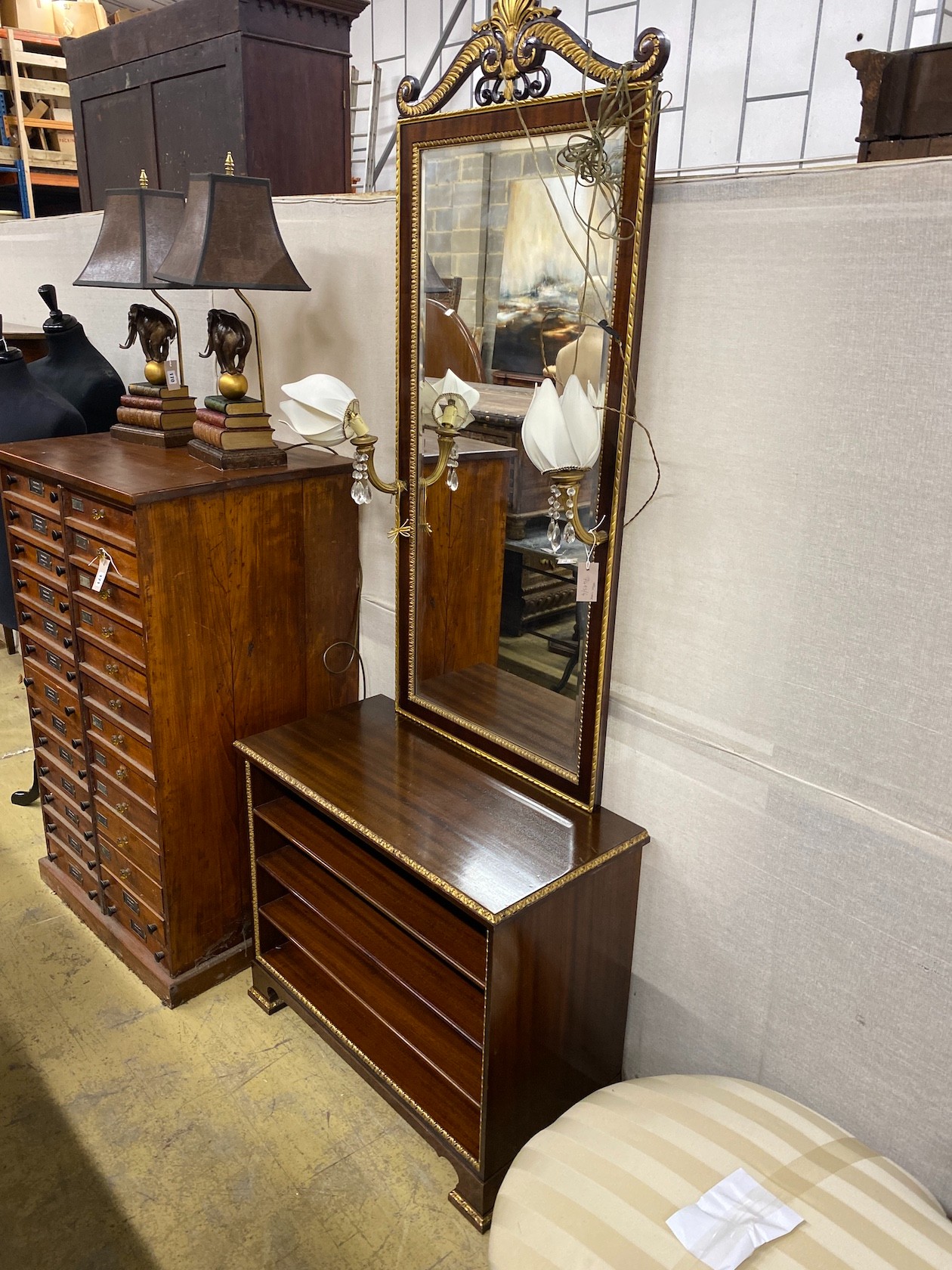 A Regency style parcelgilt console cabinet and pier mirror, width 83cm, depth 41cm, height 212cm